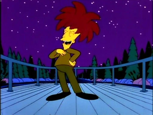 Sideshow Bob from The Simpsons with wild red hair stands confidently on a wooden bridge at night, surrounded by trees and a starry purple sky.