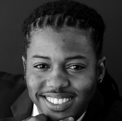 Headshot of Zwakele Tshabalala, with plaited hair and an earring