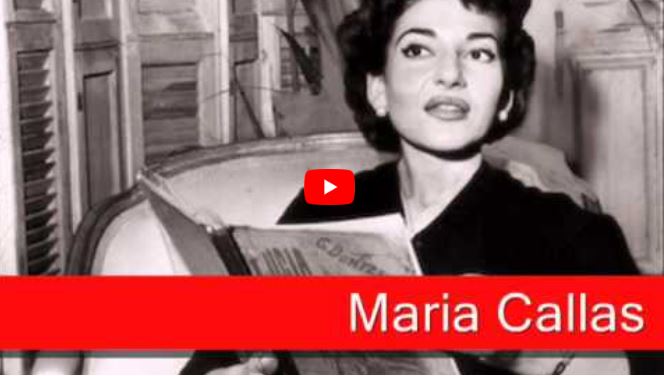 Black and white photo of a woman sitting and holding sheet music, with the text Maria Callas in bold red at the bottom.