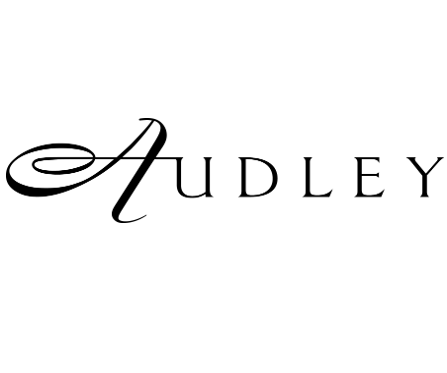 The image displays the word Audley in an elegant, stylised black font on a white background. The letter A is especially ornate with a sweeping, decorative flourish.
