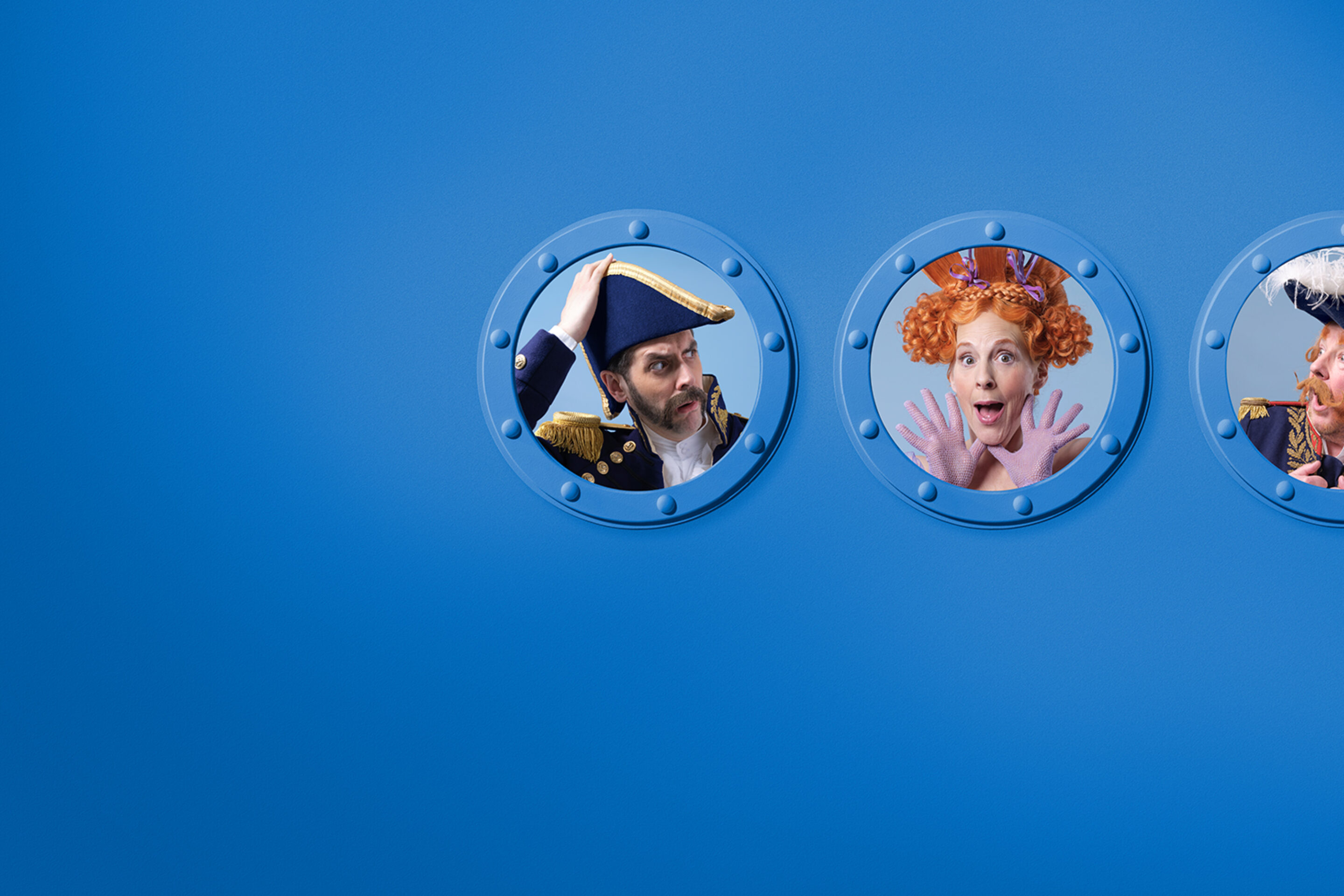 Three people in colourful, theatrical costumes and hats look out from round, blue ship portholes against a plain blue background. The left and right figures wear navy uniforms; the centre figure has red curly hair and a surprised expression.