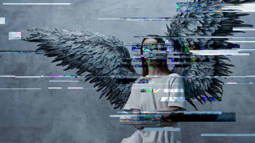 A person in a white dress with large, grey angel wings kneels on the floor against a grey wall, evoking scenes from Angel's Bone by Du Yun and Royce Vavrek. Digital glitch effects obscure parts of the figure and wings.